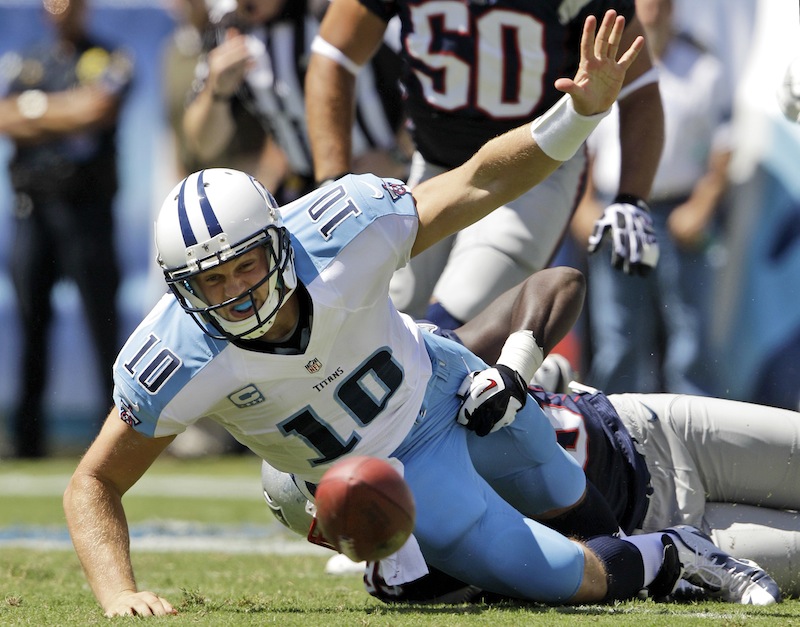 Tennessee Titans quarterback Jake Locker (10) loses the ball as he is hit by New England Patriots defensive end Chandler Jones (95) in the second quarter of an NFL football game, Sunday, Sept. 9, 2012, in Nashville, Tenn. New England Patriots linebacker Dont'a Hightower recovered the ball and ran for a touchdown. (AP Photo/Wade Payne) LP Field