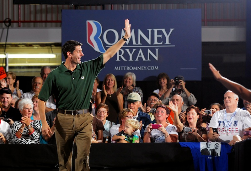 Republican vice presidential candidate, Rep. Paul Ryan, R-Wis. greets his supporters as he walks on stage to deliver a town hall speech at the Cornerstone Community Ice Center in Ashwaubenon, Wis., on Wednesday, Sept. 12, 2012. (AP Photo/The Green Bay Press-Gazette, Lukas Keapproth)