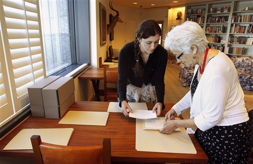 Hemingway curator Susan Wrynn, right, and intern Jessica Green collate documents from the Hemingway collection at the John F. Kennedy Library and Museum in Boston. The Associated Press photo