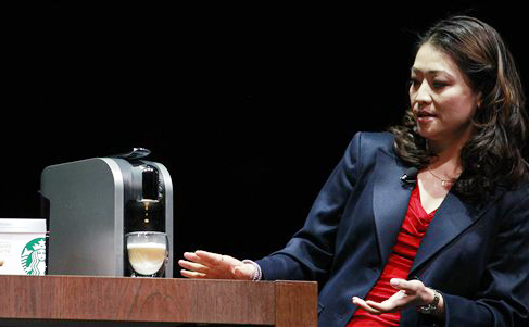 Hannah So demonstrates a "Verismo," a single-serving espresso machine, at the annual Starbucks shareholders meeting in this March 21, 2012. photo taken in Seattle.