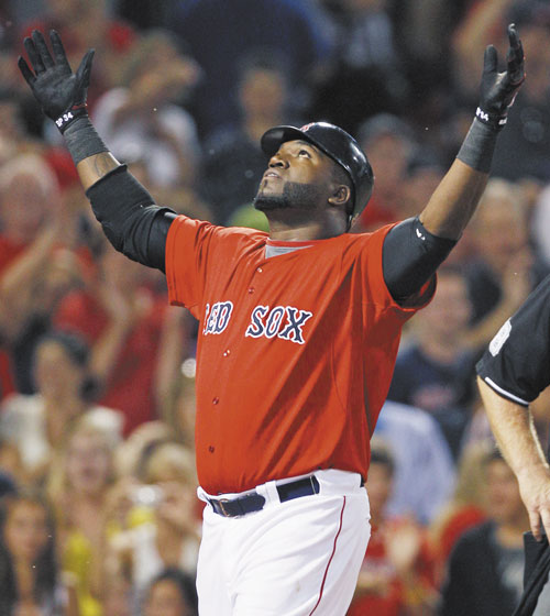 LOOKING FORWARD: Boston’sDavid Ortiz, center, was batting .318 with 23 homers and 60 RBIs before going down with an Achilles earlier this season. Ortiz is a free agent next year.