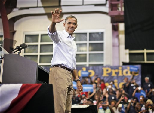 President Barack Obama waves to supporters after speaking a campaign event at Scott High School, Monday, Sept. 3, 2012, in Toledo, Ohio. (AP Photo/Pablo Martinez Monsivais)