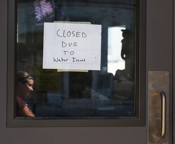 A sign on the Porthole restaurant says it was “closed due to water issues” Friday. Employees later replaced the sign with one that read: “Closed, sorry for the inconvenience.”