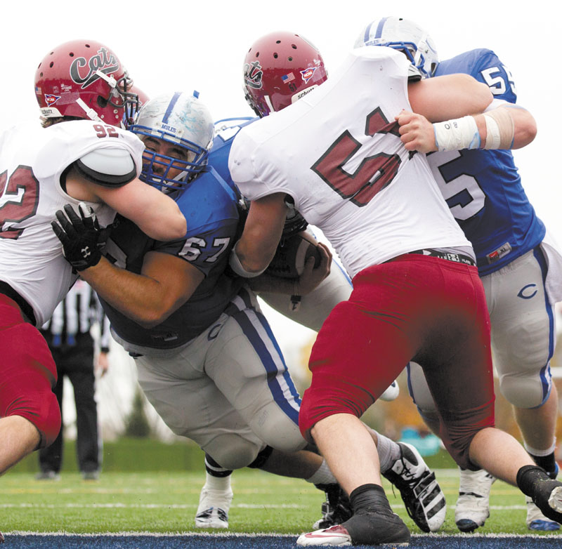 AN ALL-AROUND ATHLETE: John Gilboy (67), an offensive lineman for the Colby College football team, has a 3.7 grade-point average and is a double major. He also throws the shot on the indoor and outdoor track and field teams.