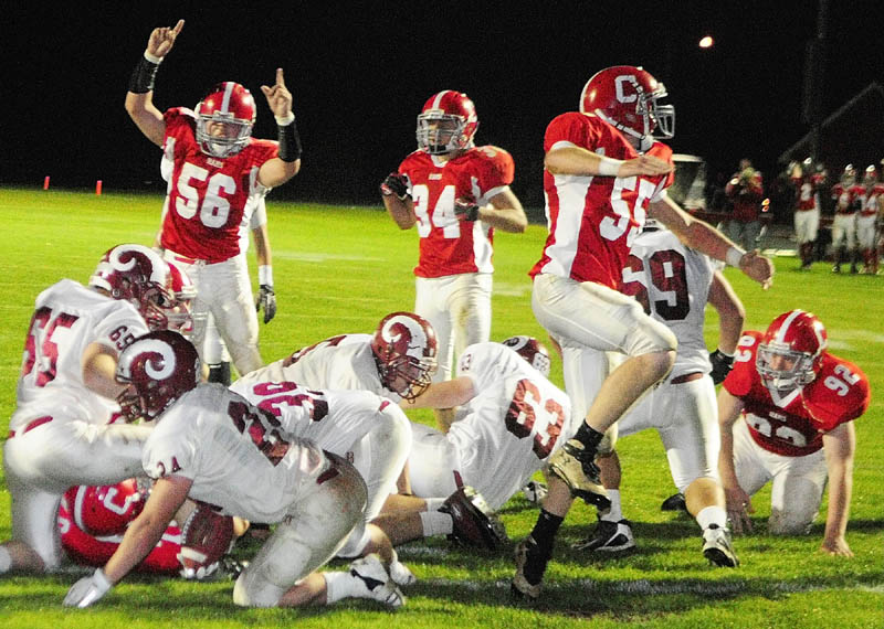TIME TO CELEBRATE: The Cony defense celebrates after scoring a safety to take a 9-7 lead over Bangor during the second quarter Friday night at Alumni Field in Augusta.