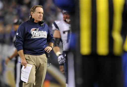 New England Patriots head coach Bill Belichick is seen past an official as he looks on in the second half of an NFL football game against the Baltimore Ravens in Baltimore, Sunday, Sept. 23, 2012. (AP Photo/Gail Burton)