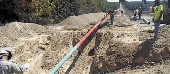 GAS IMPASSE: A still image from a video posted Tuesday on the website of Summit Natural Gas shows work crews placing and welding a 6-inch high-pressure steel pipeline in Lake of the Ozarks region, Missouri, which will serve 10 towns and about 4,000 customers. An appeals panel has found the state erred when solicited bids for a natural gas pipeline project in central Maine, awarding the bid to Central Maine Power Co.-affiliated Maine Natural Gas over Summit Natural Gas.