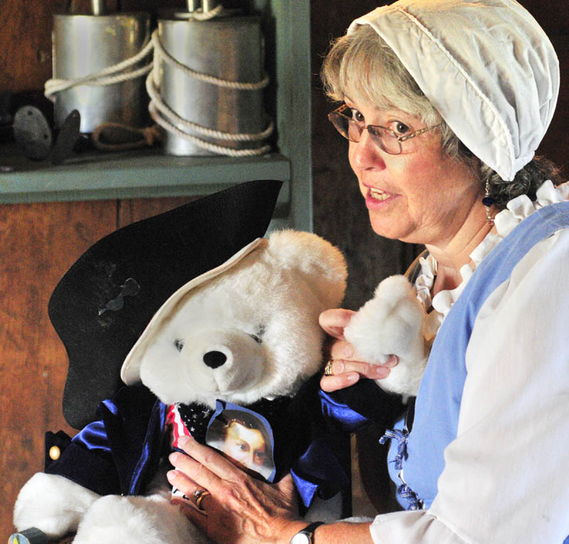 American Revolution member Bonnie Wilder talks about a Patrick Henry toy bear as she begins her "Meet the 1787 Framers" program that was part of the 225th anniversary of the US Constitution events on Saturday afternoon at Old Fort Western in Augusta.