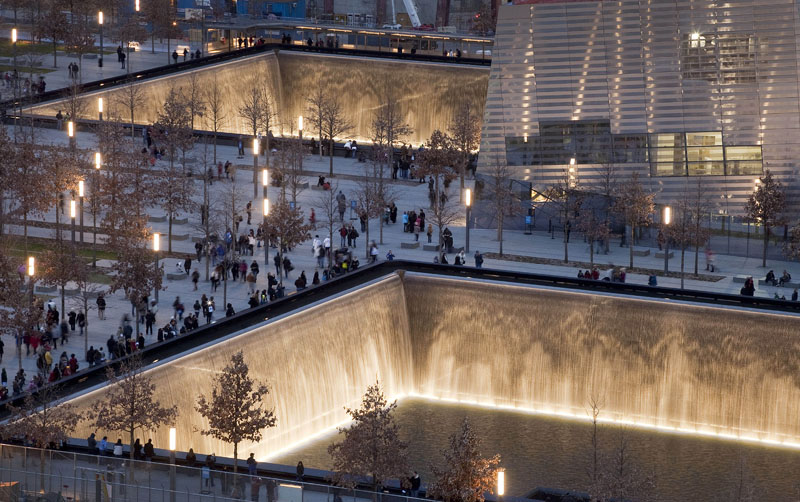 Visitors to the National September 11 Memorial in New York walk around its twin pools on Dec. 20, 2011. The foundation that runs the memorial estimates that once the roughly $700 million project is complete, it will cost $60 million a year to operate.