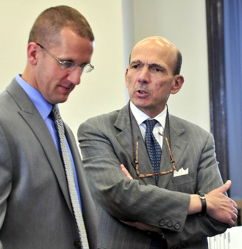 INVESTIGATION: Assistant Attorney General Andrew Benson, right, confers with Maine State Police Detective Ryan Jacques prior to opening statements in the murder trial of Jay Mercier in Somerset County Superior Court in Skowhegan on Thursday.