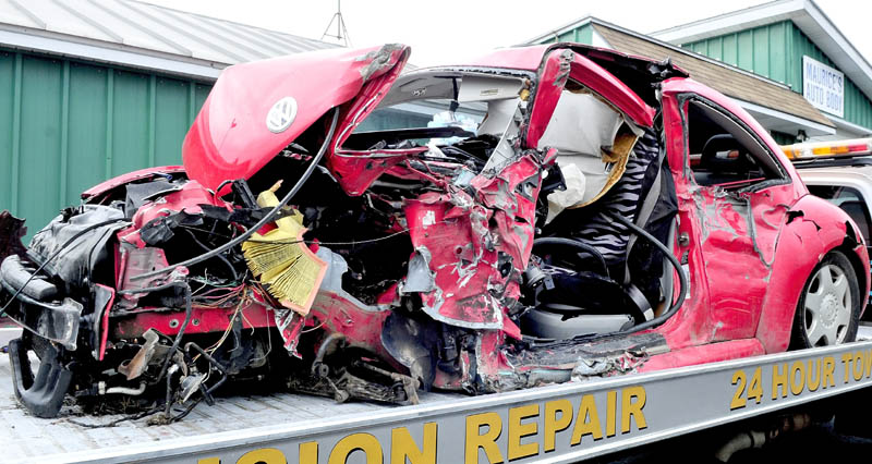 Staff photo by David Leaming Anna Clark, 18, of Waterville, underwent surgery Wednesday for injuries she received when this Volkswagen Beetle she was driving collided with a fully-loaded tractor trailer pulp truck on U.S. Route 201 in Fairfield.
