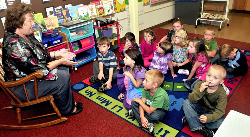 Solon Elementary School Principal Jean Butler on Tuesday explains to kindergarten students their school is one of only two in Maine to be recognized this month by the U.S. Department of Education as a 2012 National Blue Ribbon School. The award cited the school's performance and creation of lasting parent and community relations.