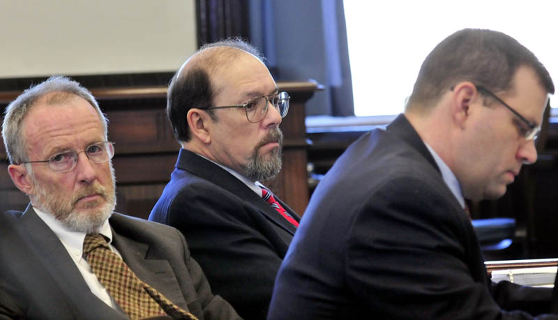 Staff photo by David Leaming DEFENSE: Murder defendant Jay Mercier sits between defense attorneys John Alsop, left, and John Martin during Mercier's trial in the death of Rita St. Peter being held at Somerset County Superior Court in Skowhegan this week.