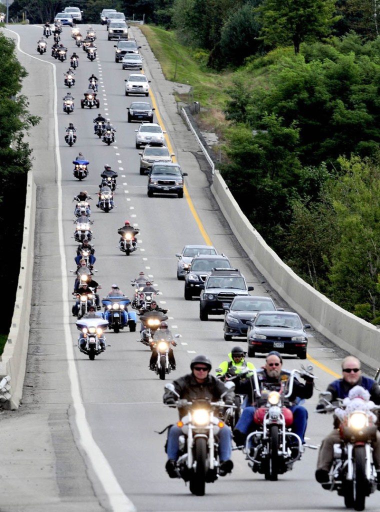 Hundreds of motorcyclists joined others on I-95 in Waterville on Sunday for the 31st annual United Bikers of Maine Toy Run, which provides toys for Maine children during the holiday season.