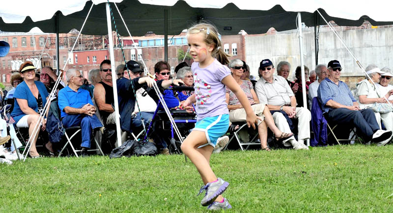 Alice Willette dances as folks listen to the Blistered Fingers blue grass band perform during the Franco-American Festival in Waterville on Sunday. The festival, which included food and concessions, was held at Head of Falls. “I hope some kids come out and dance with me,” Willette said.