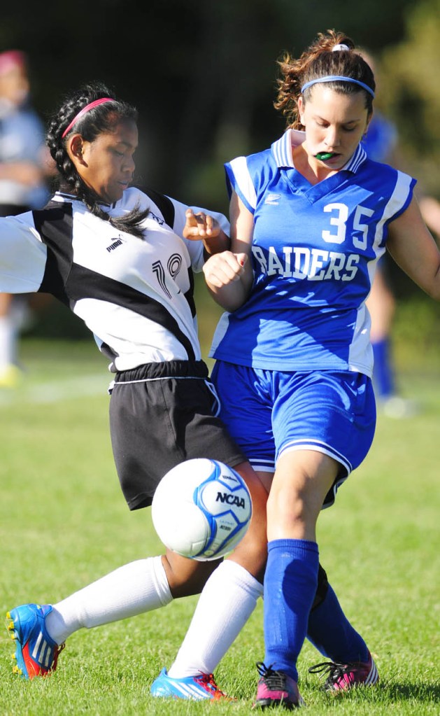 Hall-Dale's Dani Sweet, left, and Oak Hill's Toni Hart collide during a game on Wednesday afternoon at Hall-Dale High School in Farmingdale.