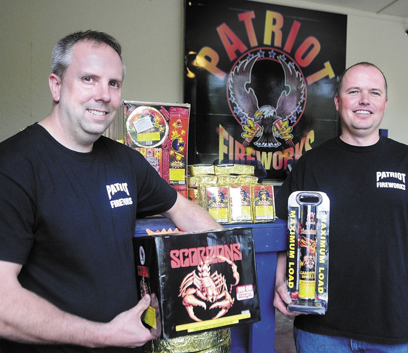Staff photo by Joe Phelan Another view: Tim Bolduc, left, and Jay Blais recently opened Patriot Fireworks in Monmouth earlier this year. A petition drive to limit fireworks use in Monmouth would not affect sales.