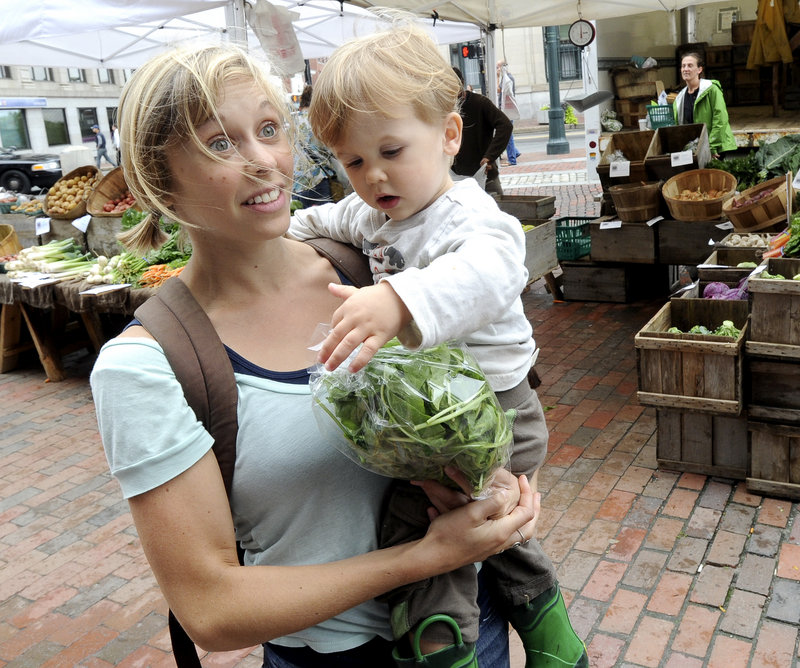 Anna Korsen of Portland, shopping with her 2-year-old son, Arlo Korsen-Cayer, says, "I tend to buy organic because of the impact conventional farming has on the environment and the pesticides that are in a lot of conventionally grown food."