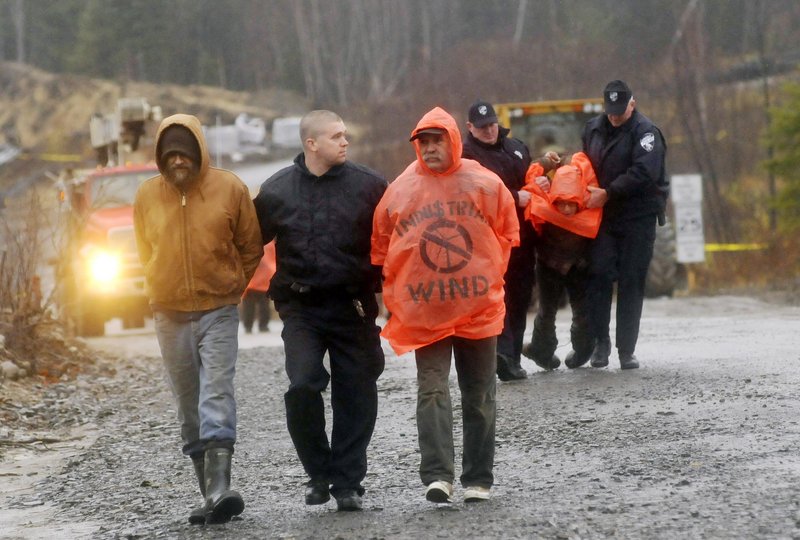 Protesters are arrested after blocking construction vehicles at a wind energy project in Lincoln in 2010. Wind power supporters and opponents are waiting to see if Congress will let federal subsidies for the industry expire.