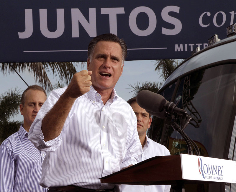 Republican presidential candidate Mitt Romney, flanked by Rep. Mario Diaz-Balart, R-Fla., and Sen. Marco Rubio, R-Fla., speaks at a campaign event Aug. 13 in Miami. Romney must redouble his efforts in Florida and Ohio, analysts say.