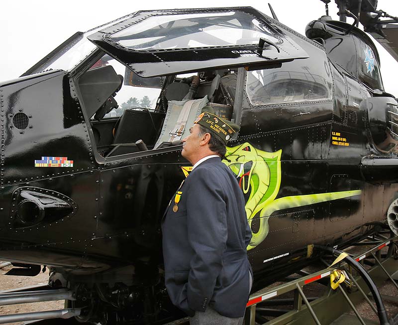 Wayne Sapiel of Jay checks out the cockpit of a U.S. Army Cobra Attack helicopter at the POW/MIA Recognition Weekend at The BallPark in Old Orchard Beach on Saturday. Sapiel served two tours in Vietnam with the Army in 1967 and 1968.