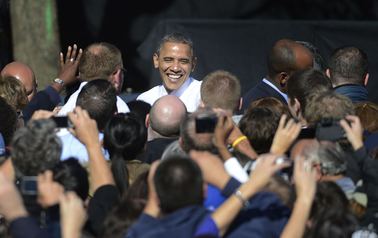 President Barack Obama shakes hands with supporters as he leaves Veterans Memorial Park in Manchester, N.H., Thursday.