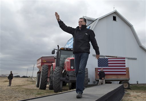 Republican presidential candidate, former Massachusetts Gov. Mitt Romney waves as he arrives for a campaign rally, Tuesday, Oct. 9, 2012, in Van Meter, Iowa. (AP Photo/ Evan Vucci)