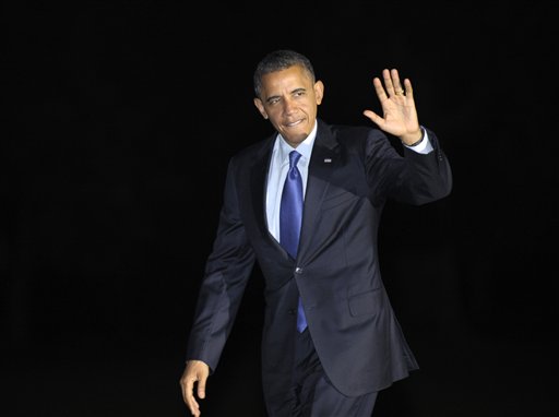 President Barack Obama waves as he returns to the White House in Washington, Wednesday, Oct. 17, 2012, after campaigning in Iowa and Ohio. (AP Photo/Susan Walsh)