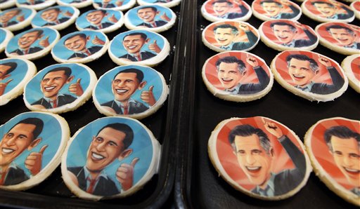 Platters of sugar cookies bearing the likenesses of President Barack Obama, left, and Republican presidential candidate Mitt Romney, are available for sale on the counter at the Oakmont Bakery on Wednesday, Oct. 17, 2012 in Oakmont, Pa. (AP Photo/Keith Srakocic)