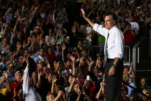 Republican presidential candidate, former Massachusetts Gov. Mitt Romney waves during a campaign stop at the Bank United Center, at The University of Miami, in Coral Gables, Florida, Wednesday, Oct. 31, 2012. (AP Photo/Charles Dharapak)