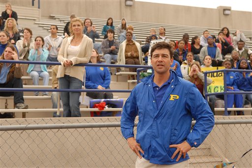 FILE - This 2006 photo, provided by NBC Universal, shows actors Connie Britton, standing center left, as Tami Taylor, Kyle Chandler, foreground, as Eric Taylor in the NBC series "Friday Night Lights." Mitt Romney is giving a campaign-trail twist to an inspirational slogan from the TV series "Friday Night Lights" as he rides an upswing in polls after last week�s debate. The coach of the football team at fictional West Dillon High School in rural Texas would build up the Panthers by saying, "Clear eyes, full hearts, can't lose!" �Friday Night Lights� aired on NBC and DirectTV over five years, ending last year, and remains a Romney favorite. (AP Photo/NBC, Bill Records)