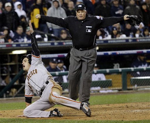 San Francisco Giants' Ryan Theriot reacts after scoring from second on a hit by Marco Scutaro during the 10th inning of Game 4 of baseball's World Series against the Detroit Tigers Sunday, Oct. 28, 2012, in Detroit. (AP Photo/David J. Phillip) MLB