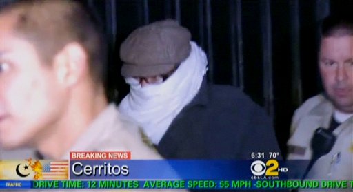 In this Sept. 15, 2012, image from video provided by CBS2-KCAL9, Nakoula Basseley Nakoula, the man behind the anti-Islamic video that inflamed parts of the Middle East, is escorted by Los Angeles County sheriff's deputies from his home in Cerritos, Calif.
