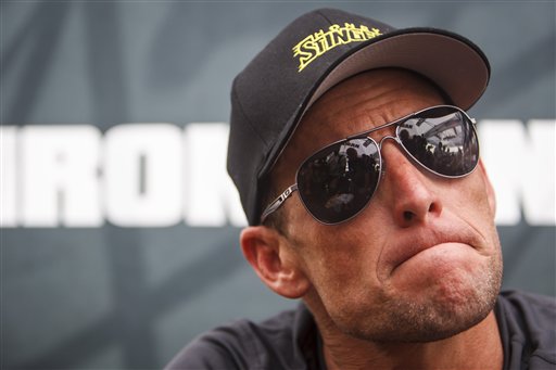 Seven-time Tour de France champion Lance Armstrong grimaces during a news conference in this April 1, 2012, photo.