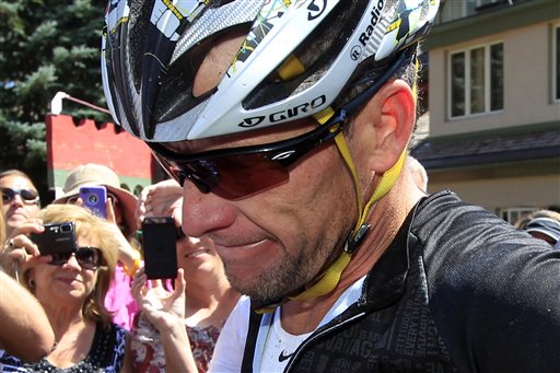 In this Aug. 25, 2012, photo, Lance Armstrong considers a question from a reporter after his second-place finish in the Power of Four mountain bicycle race at the base of Aspen Mountain in Aspen, Colo.
