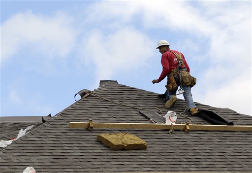 In this Oct. 12, 2012, photo, a construction worker finishes a roof in Chicago. Confidence among U.S. homebuilders is at its highest level in six years in October, reflecting improved optimism over the strengthening housing market this year and a pickup in visits by prospective buyers to builders' communities.