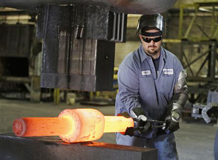 Jack Knox positions a hot spindle being shape at Solmet Technologies in Canton, Ohio. US unemployment fell to 7.8 percent Friday, a 44-month low.