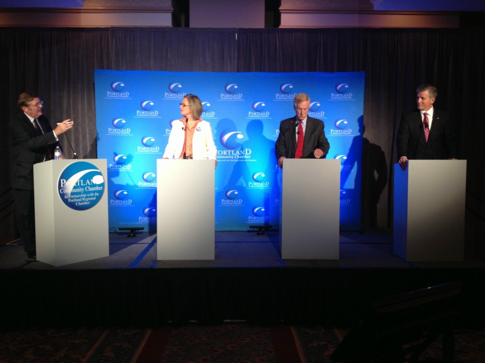 Left to right, Chris Hall, moderator, and U.S. Senate candidates Cynthia Dill, Angus King and Charlie Summers appeared at the Eggs and Issues Debate hosted by the Portland Regional Chamber. Gordon Chibroski/Staff Photographer