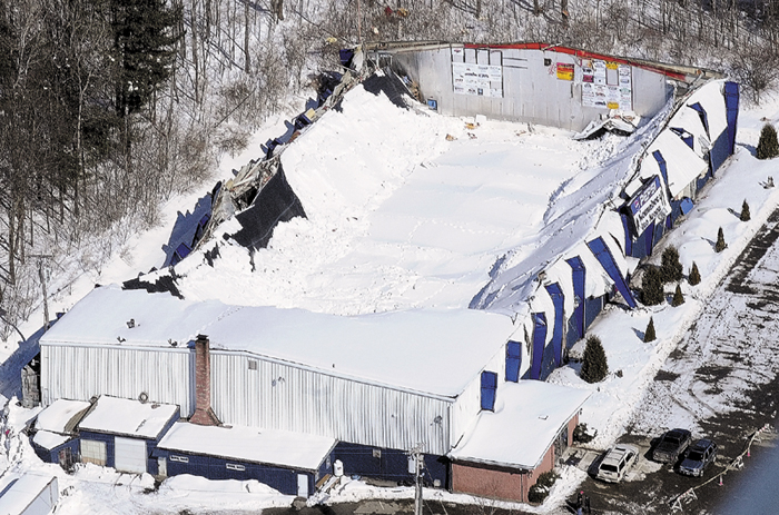 This aerial photo, taken Thursday, March 3, 2011, shows the collapsed roof of the Kennebec Ice Arena in Hallowell. The arena is suing its insurers, claiming coverages were inadequate for the damages sustained in the collapse.