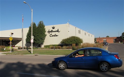 A car moves past the Hallmark Cards Inc. plant in Topeka, Kan., Tuesday, Oct. 2, 2012. The company says it plans to close the plant by the end of 2013. (AP Photo/John Hanna)