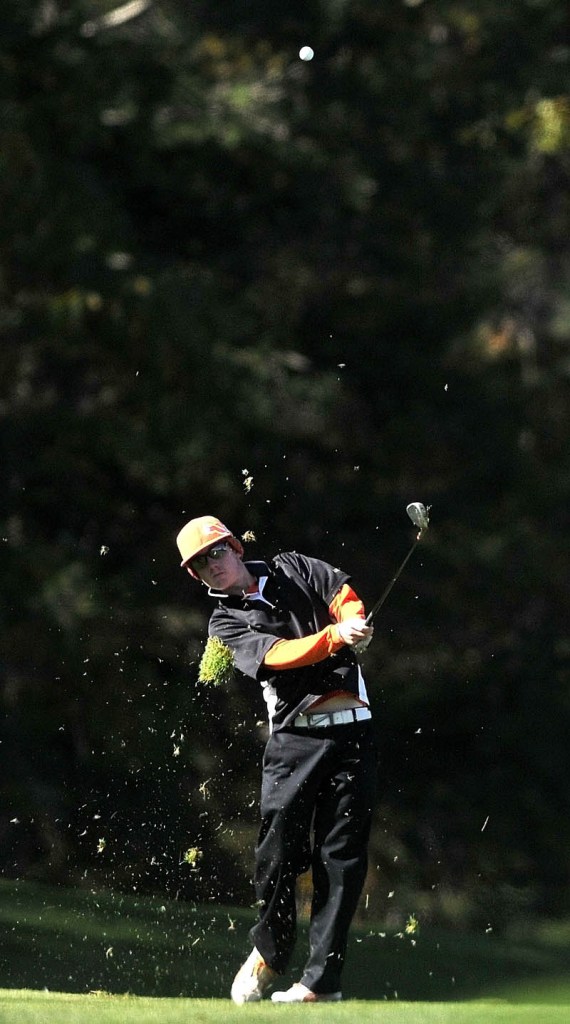 Maranacook High School's Luke Ruffing, swings for the green on the 15th hole during the High School Individual Golf Championship at Natanis Golf Course in Vassalboro on Saturday.