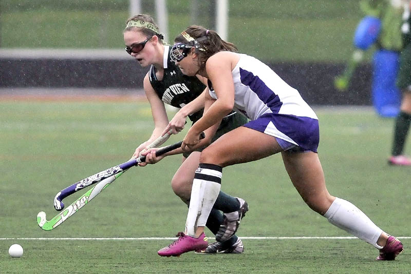 FUN IN THE RAIN: Mt. View High School’s Braley Leadbetter (7) back, battles for the ball with Waterville Senior High School’s Sage Duguay (4) in the first half at Thomas College in Waterville Thursday. Mt. View defeated Waterville 2-1.