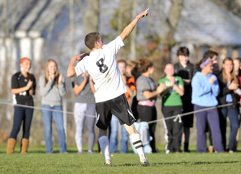 CELEBRATE: Winslow High School’s Gabe Smith celebrates his goal against Oceanside High School in the second half of an Eastern B quarterfinal game Wednesday at Kennebec Savings Bank field in Winslow. Smith scored twice and Winslow defeated Oceanside 2-0.