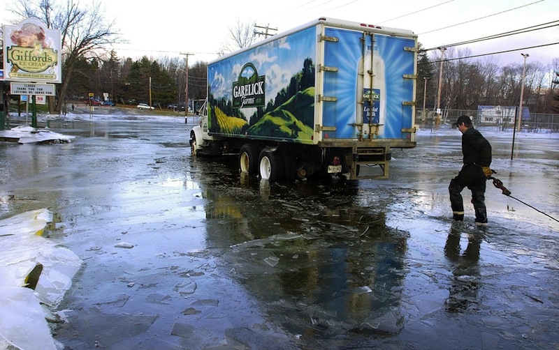 In this 2006 file photo, a Garelick Farms truck sits near U.S. Route 2 in Farmington. Garelick Farms is ending production at its Bangor milk-processing plant and laying off 35 employees.