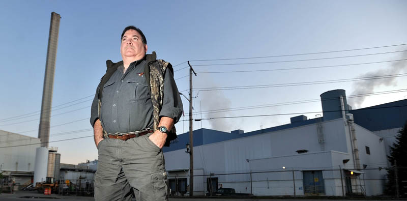 Longtime employee Walter Smith stands outside the Madison Paper Industries mill in this Nov. 2011 file photo. U.S. officials are concerned that Canadian subsidies to their paper mill will hurt Maine business.
