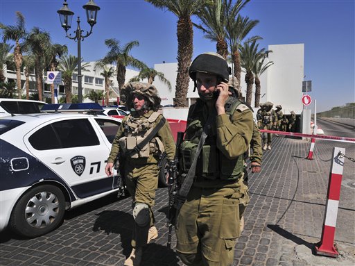 Israeli soldiers secure the area near the site of a shooting incident at a hotel in the Red Sea resort town of Eilat, Israel on Friday.