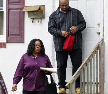 Anita Saunders, mother of two teenage brothers charged in the murder of Autumn Pasquale, 12, leaves her home on Thursday in Clayton,. N.J., with her husband Richard Saunders.