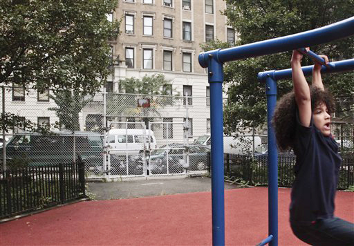 Nicholas Gayles, 6, a student at P.S. 75, plays in the school's playground across the street from a shelter on 95th Street on Oct. 3, 2012 in New York.