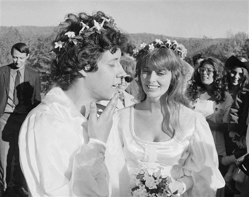 An Oct. 9, 1969, photo of Arlo Guthrie singing "Amazing Grace" to his new bride Jackie Hyde, at their wedding ceremony on Guthrie's farm in Washington, Mass.