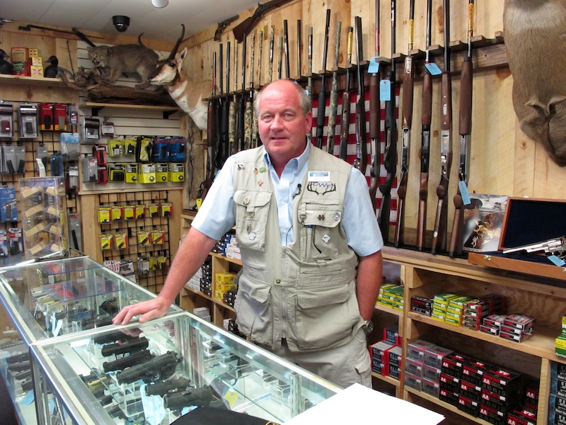 This photo taken Aug. 22, 2012, shows Central Wisconsin Firearms owner Frederick Prehn in his store in Wausau, Wis. He says he's had to expand his business to the new location last summer because of increased gun sales. He attributes the spike to Wisconsin's new concealed carry law as well as the uncertainty about the upcoming election. President Barack Obama is presiding over a heyday for the gun industry despite predictions he would be the most anti-gun president in history. An Associated Press analysis finds gun sales are on the rise and stocks of major gun companies are up. The number of federally licensed gun dealers is increasing for the first time in nearly 20 years. And the National Rifle Association is bursting with cash and political clout. (AP Photo/Carrie Antlfinger)